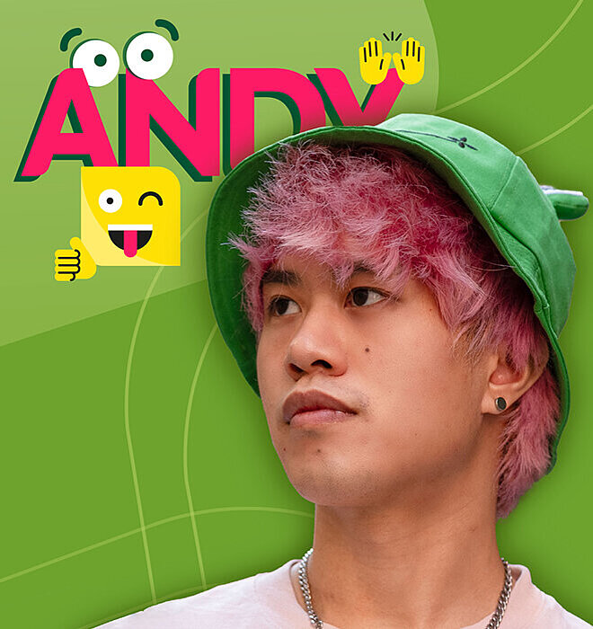 Junger Mann mit pinken Haaren und grünem Fischerhut