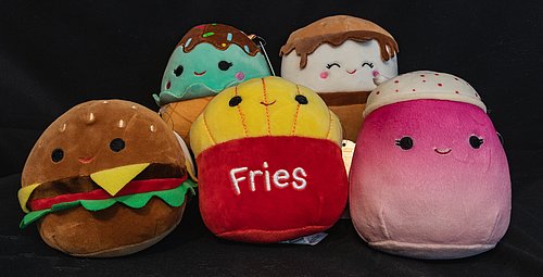 Five different cuddly toys in the shape of food such as burgers, fries and ice cream