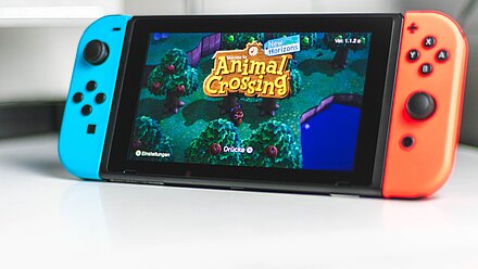 How Nintendo Games Became a Clever Marketing Platform for Companies A Nintendo Switch is on a table and the game "Animal Crossing" can be seen on the screen.