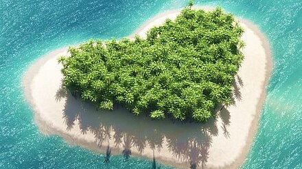 What is Love? (Island) Baby Don't Hurt Me. A small island with many trees in the shape of a heart surrounded by light blue water.