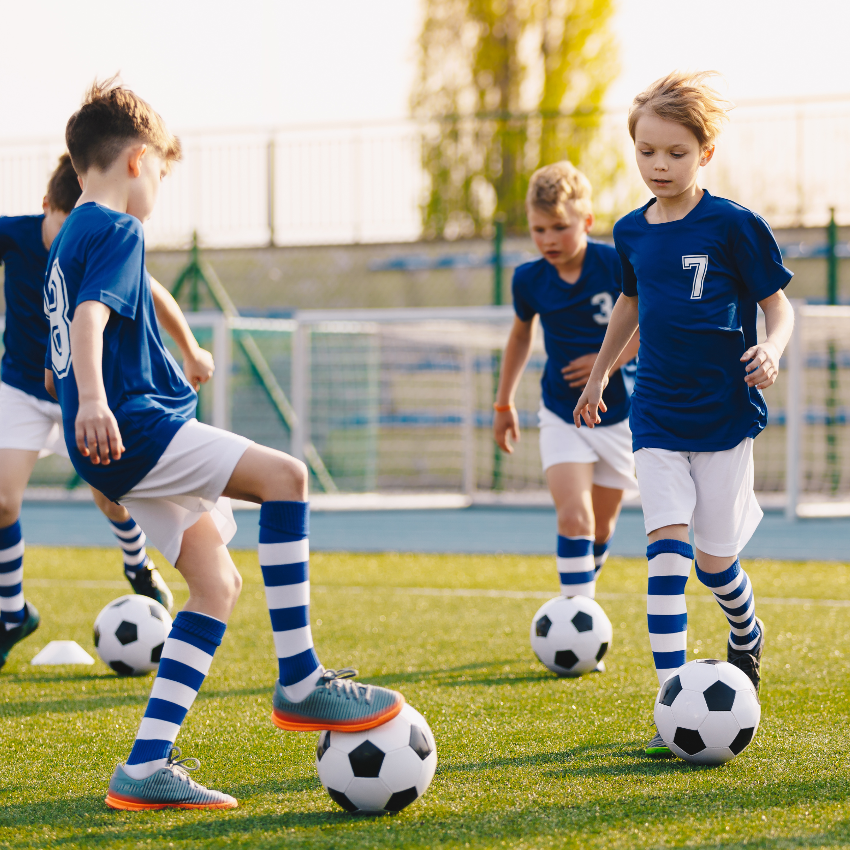 Young boys from the same team are on the football pitch and play their way in.