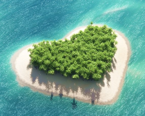 A small island with many trees in the shape of a heart surrounded by light blue water.